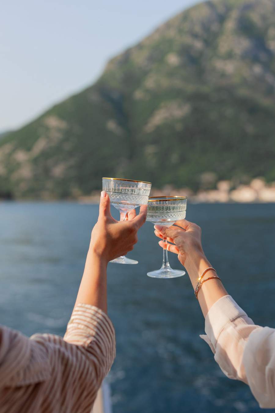 Champagne coupes toasting at sunset on our yacht