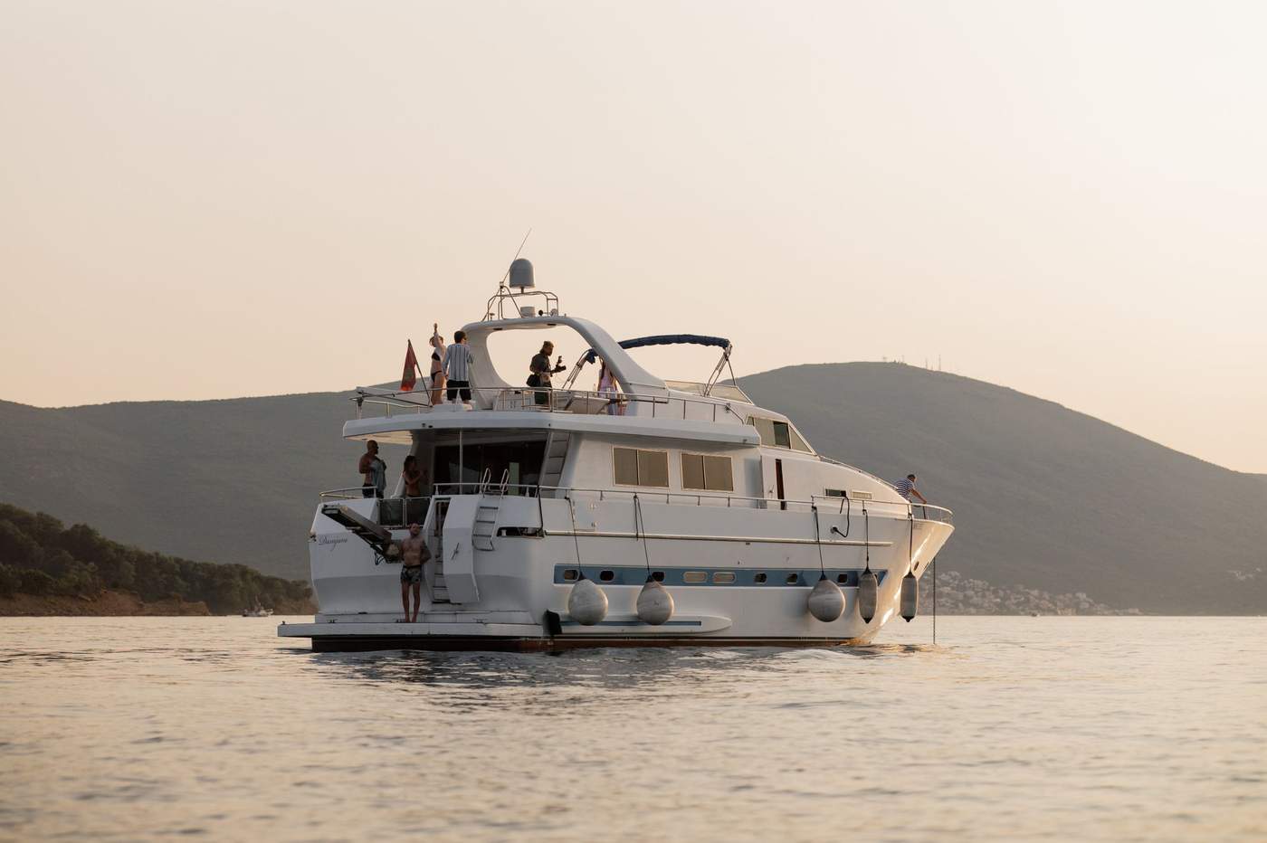 Our yacht cruising at sunset along the Montenegrin coast